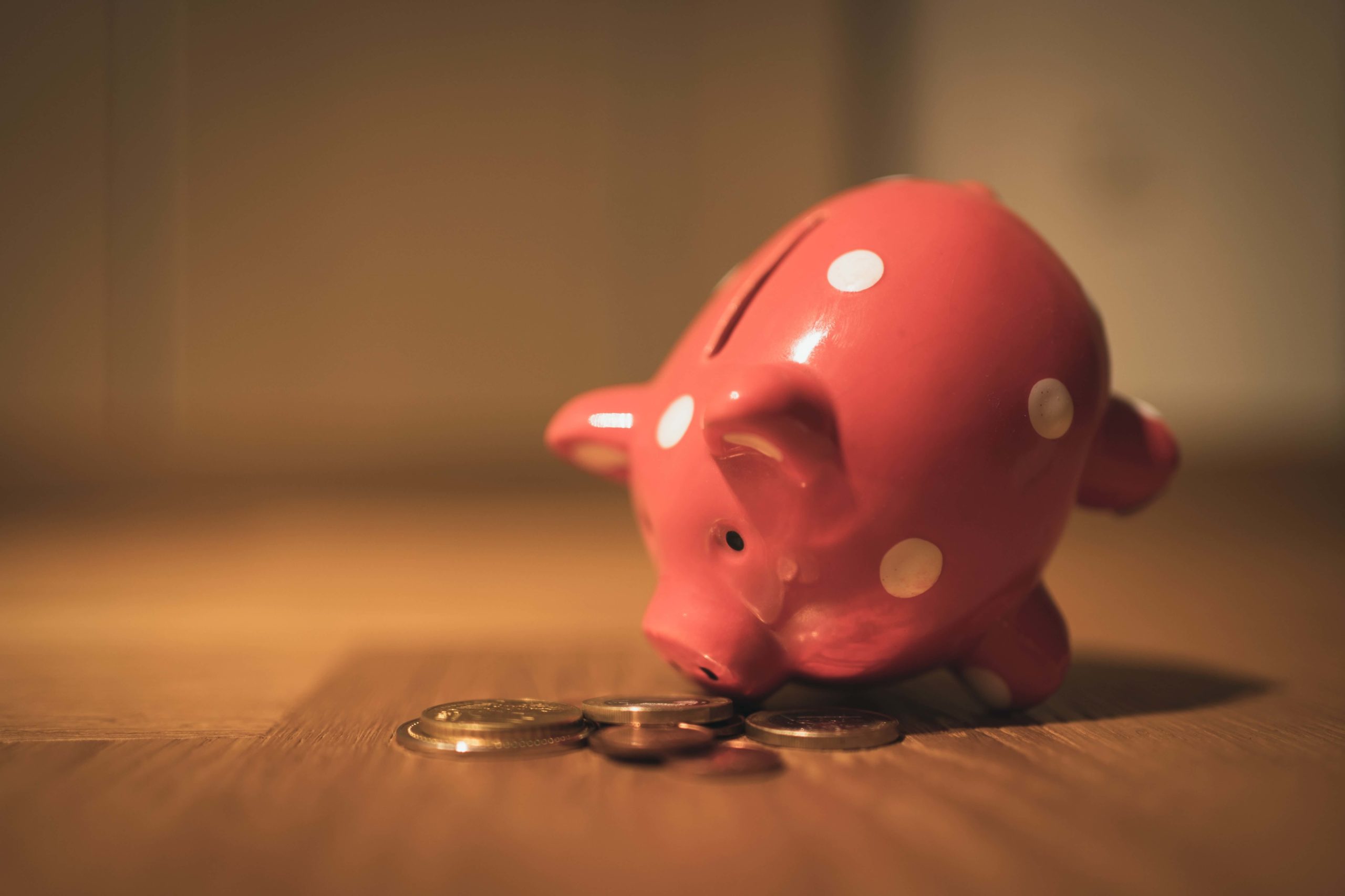 Is Your Bank Paying You Enough Is Your Bank Paying You Enough | Piggy Bank Eating Coins | Blog Keeler and Nadler